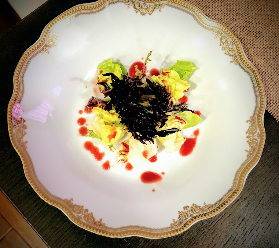 Salad in bowl with triple berry dressing